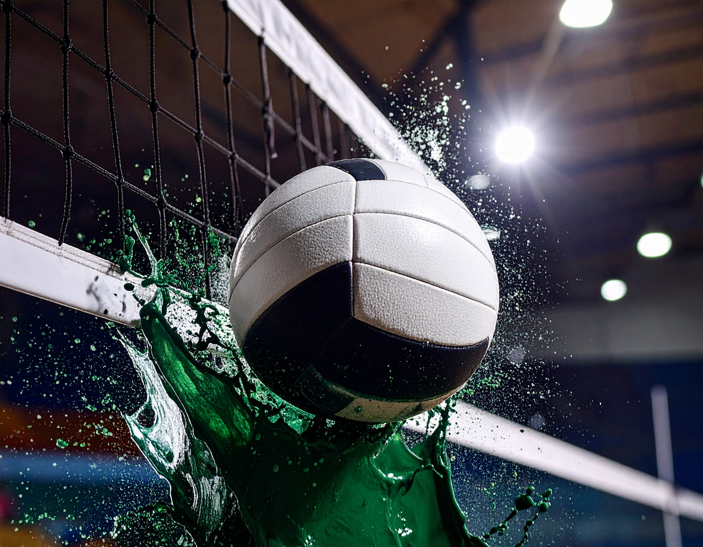 volleyball going over net with green paint